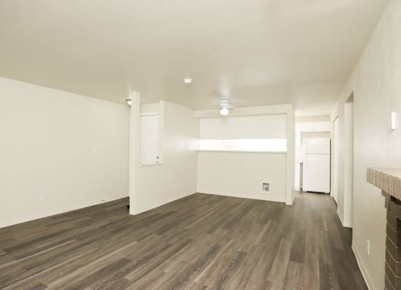 A room with wooden floors and white walls.