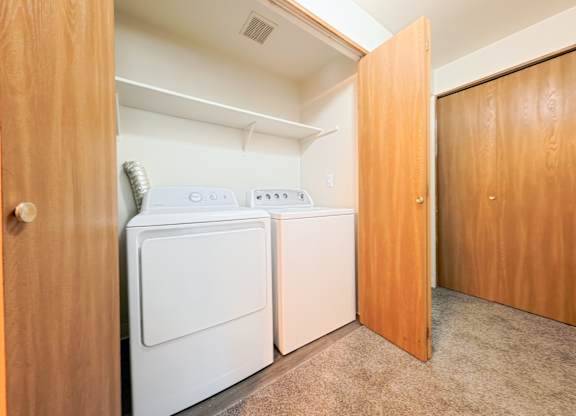 A laundry room with a washer and dryer.