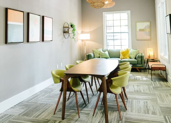 community coworking table in the business center at Tapestry at Hollingsworth Park