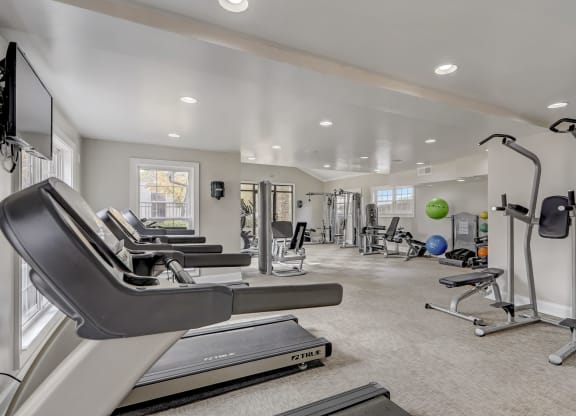 a gym with treadmills and other exercise equipment at Veridian Sandy Springs