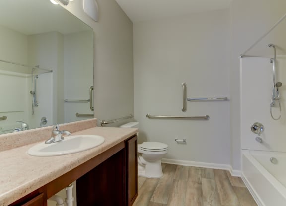 the heights at converse apartments inside bathroom with hardwood style flooring