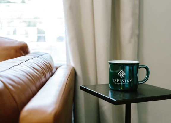 tapestry coffee cup in living room