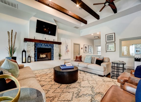 a living room with a fireplace and a flat screen tv