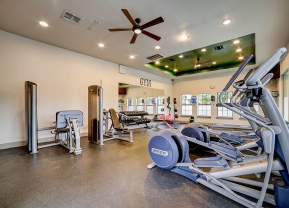a gym with a variety of exercise equipment