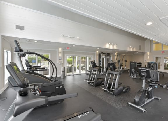 a gym with cardio machines and other exercise equipment at the estates at johnston crossing