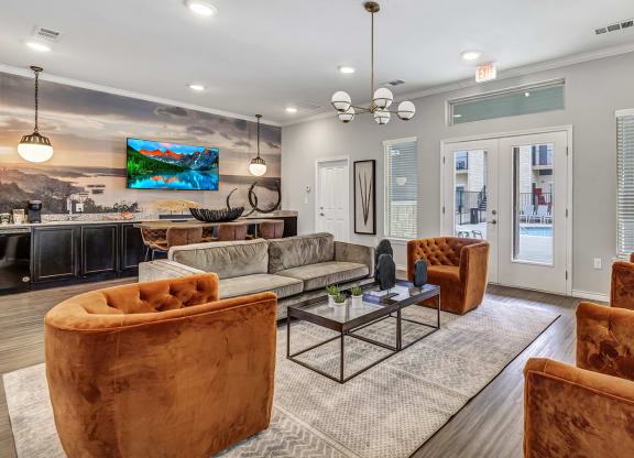 Leasing office room with couches and chairs and a table