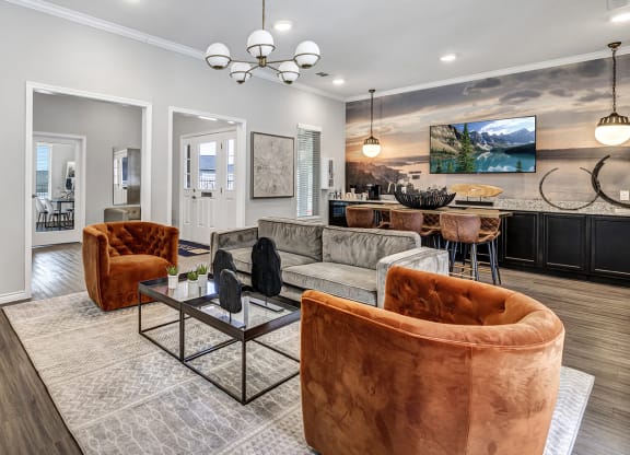 a living room with couches and chairs
