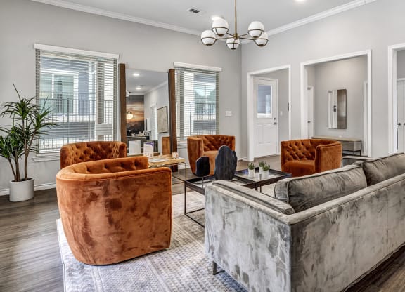 Leasing office at Sendero Ridge Apartments Kerrville with couches and chairs and a table