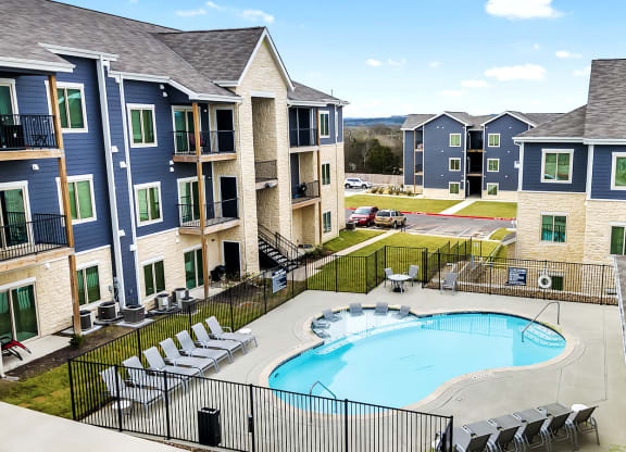 an aerial view of Sendero Ridge Apartments Kerrville with a swimming pool
