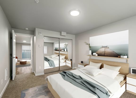 a renovated bedroom with a large bed and a mirror at  Foster Creek apartments in Tukwila