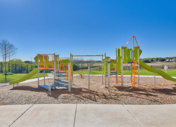 a newly renovated childrens playground at the heights at converse apartments in texas