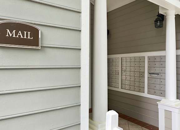 a mail room with mailboxes on the side of a building at Lexington Farms apartments