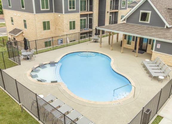 Aerial view of pool and float deck with lounge chairs