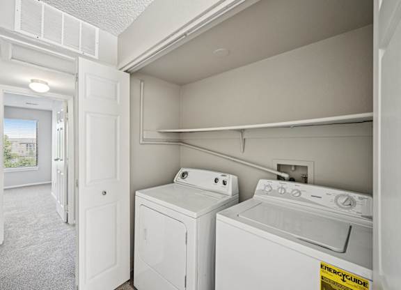 the laundry room is equipped with a washer and dryer