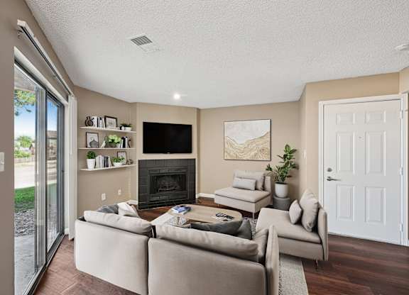 A living room with a fireplace and a couch.