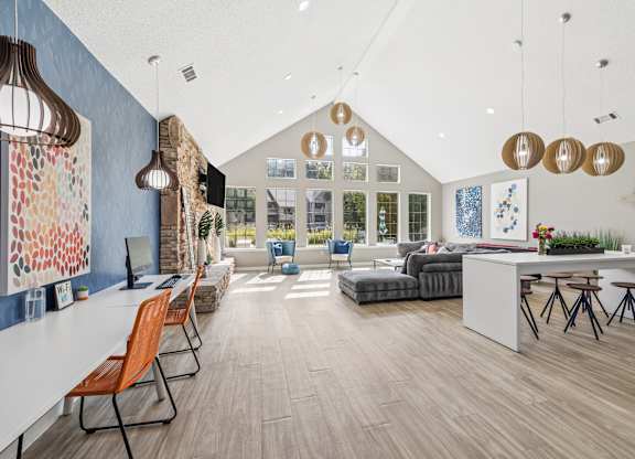 A modern office space with a long table and chairs.