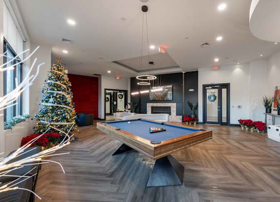 A room with a pool table at Metro 303, Hempstead, NY, 11550