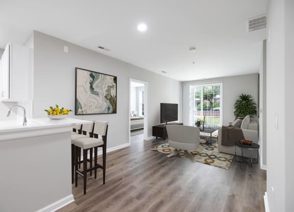 an open living room with a kitchen and a living room at The Lena, Raritan, NJ 08869