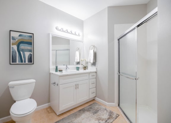 a bathroom with a toilet sink and a shower at The Lena, Raritan, NJ 08869