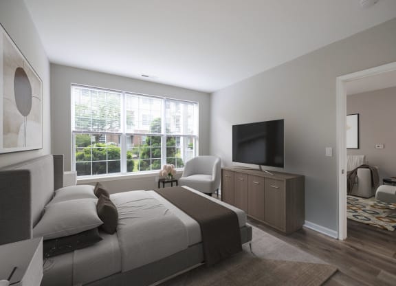 a bedroom with a bed and a tv in front of a window at The Lena, Raritan, NJ 08869
