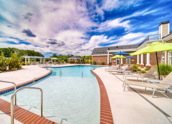 a large swimming pool with sun shelf at Meridian Obici, Suffolk Virginia