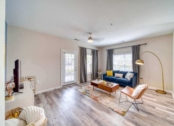 A spacious apartment living room at Meridian Obici, Suffolk, VA