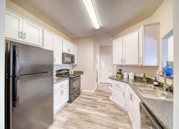 a kitchen with stainless steel appliances at Meridian Obici, Suffolk
