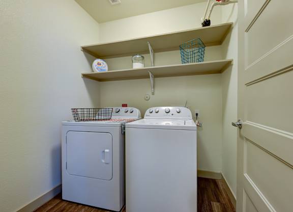 White machines in laundry room at Agave, San Antonio, TX