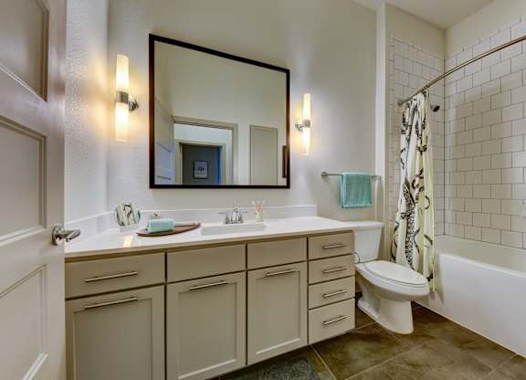 Bathroom with mirror, sink and toilet at Agave, San Antonio, TX, 78205
