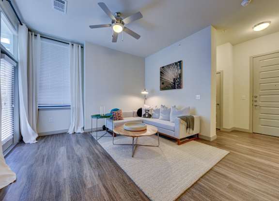 Living room with couch and ceiling fan at Agave, San Antonio, TX, 78205