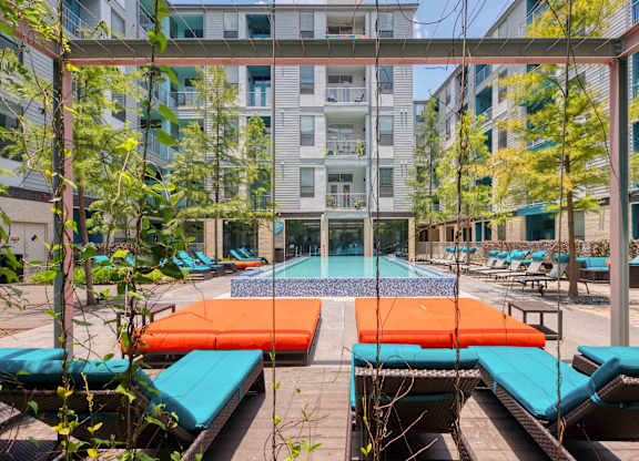 Pool surrounded by sun loungers at Agave, Texas, 78205