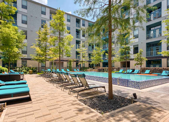 Pool surrounded by sunloungers at Agave, San Antonio, 78205