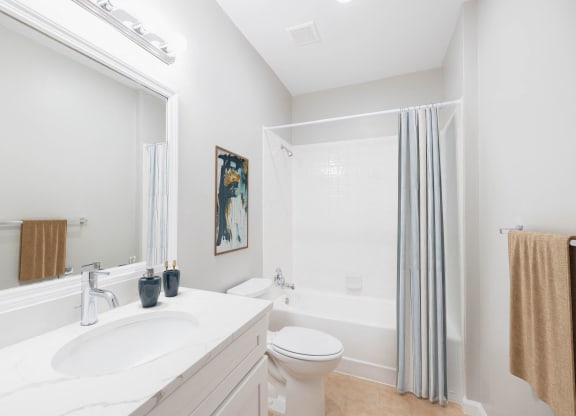 a bathroom with a sink and a toilet and a shower at The Lena, Raritan, NJ 08869