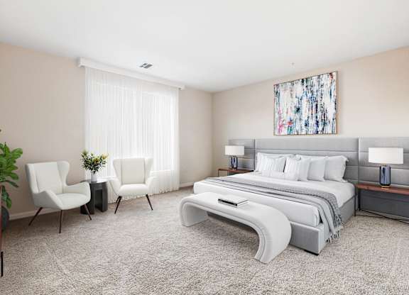 A bedroom with a large bed, two chairs, and a painting on the wall  at Metro 303, Hempstead, NY, 11550