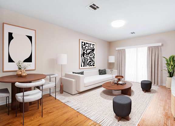 A living room with a white sofa, a coffee table, a TV, and a plant  at Metro 303, Hempstead, NY, 11550