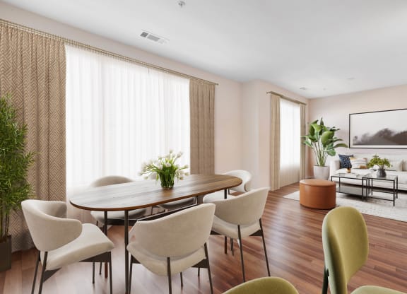 a dining room with a table and chairs at West 130, West Hempstead, 11552