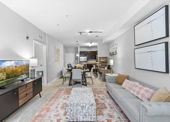 a living room with a couch and a tv at Harbor Pointe, Bayonne, New Jersey