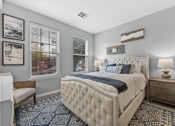a bedroom with a large bed and two windows  at Harbor Pointe, Bayonne, NJ, 07002