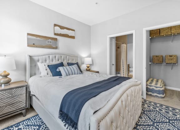 a bedroom with a bed and a closet  at Harbor Pointe, Bayonne, 07002