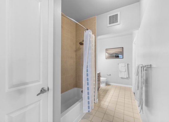 a bathroom with a shower and a toilet at Harbor Pointe, New Jersey, 07002