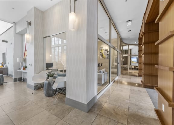 Hallway to Gym, Business Center, Game Room, and The Clubhouse with a pool table, entrance to outdoor pool, a bar and kitchen at Harbor Pointe, New Jersey, 07002