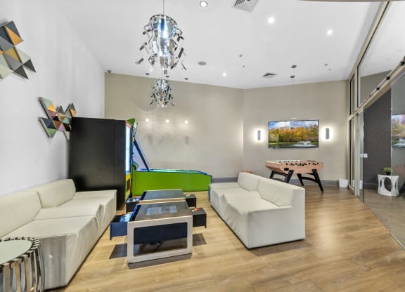 a games room with a foosball table and mini bowling at Harbor Pointe, Bayonne