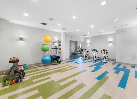a spacious fitness center with treadmills and other exercise equipment  at The Lena, New Jersey