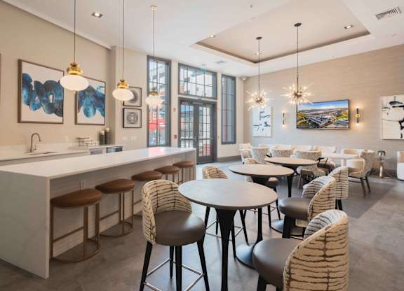 A modern kitchen with a bar area and dining area. at Harbor Pointe, New Jersey, 07002