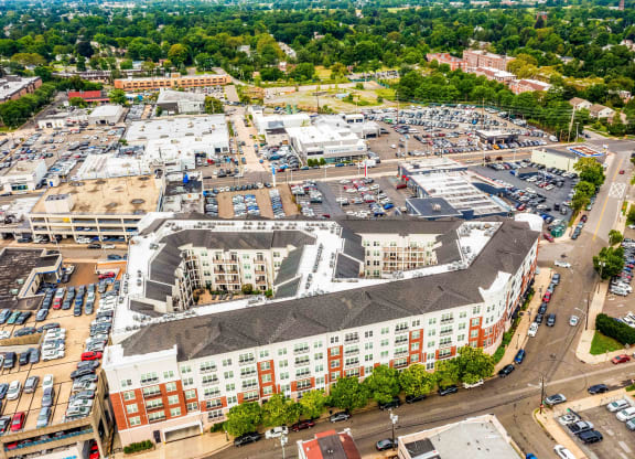 an aerial view of a large building in a city at Metro 303, New York, 11550