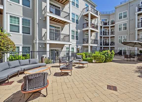 Seating in outdoor courtyard area at Metro 303, Hempstead, NY, 11550