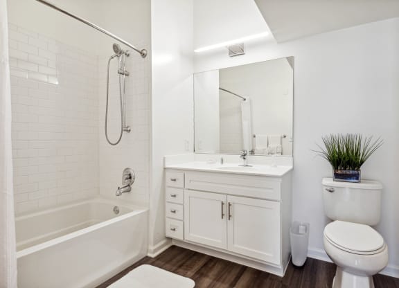 a bathroom with a toilet sink and bathtub at Metro 303, New York