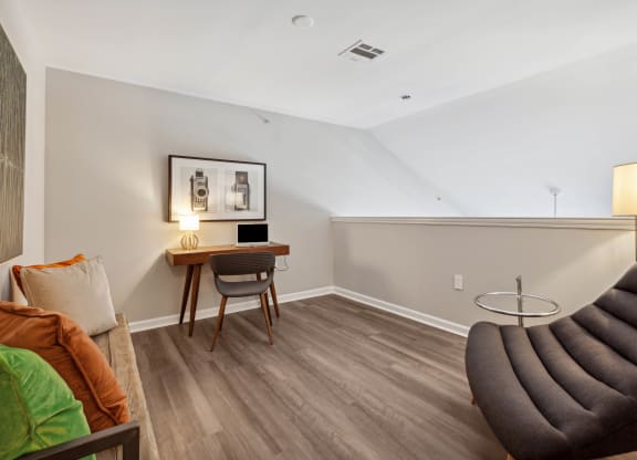 a bedroom with a desk and chair in a 555 waverly unit at Metro 303, Hempstead