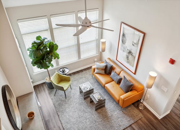 an overhead view of a living room with a couch and chairs at Metro 303, New York