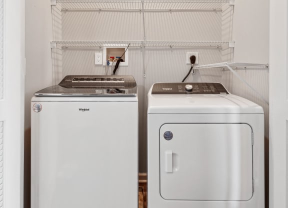 a small laundry room with a washer and dryer at Metro 303, New York, 11550